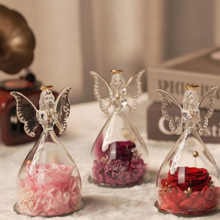 Glas engel bevaret blomstergave